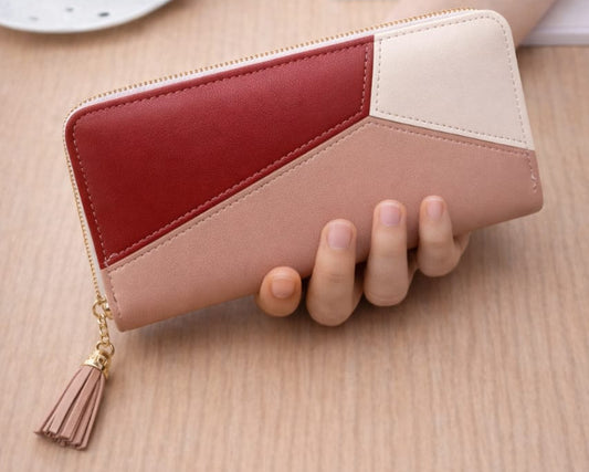 Elegant red and pink ladies wallet with modern patchwork design and zipper closure