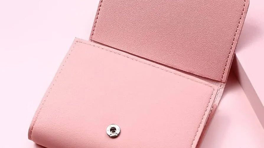 Pink wallet on a pink background