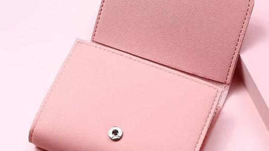 Pink wallet on a pink background