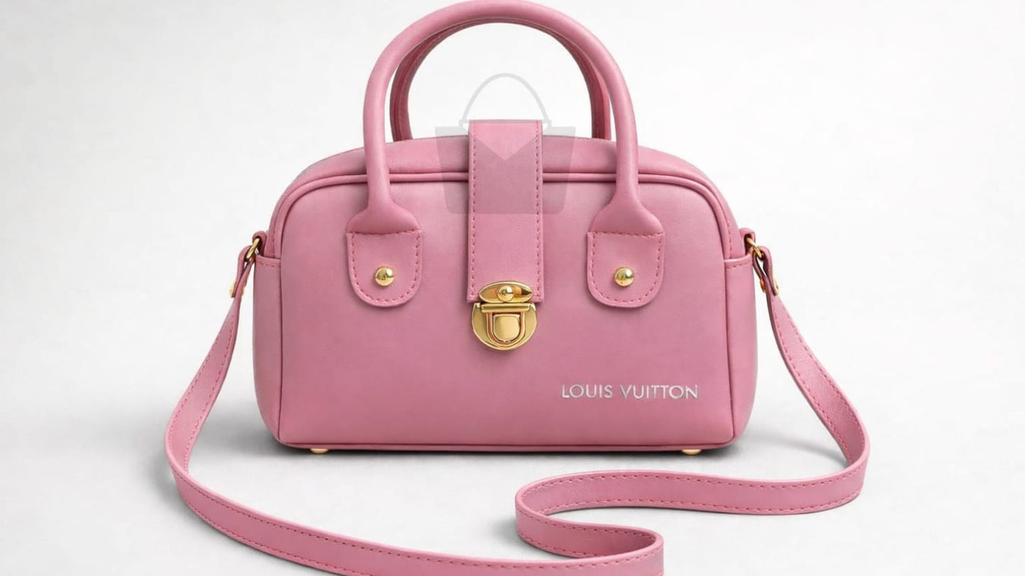 Pink handbag with gold accents on a white background